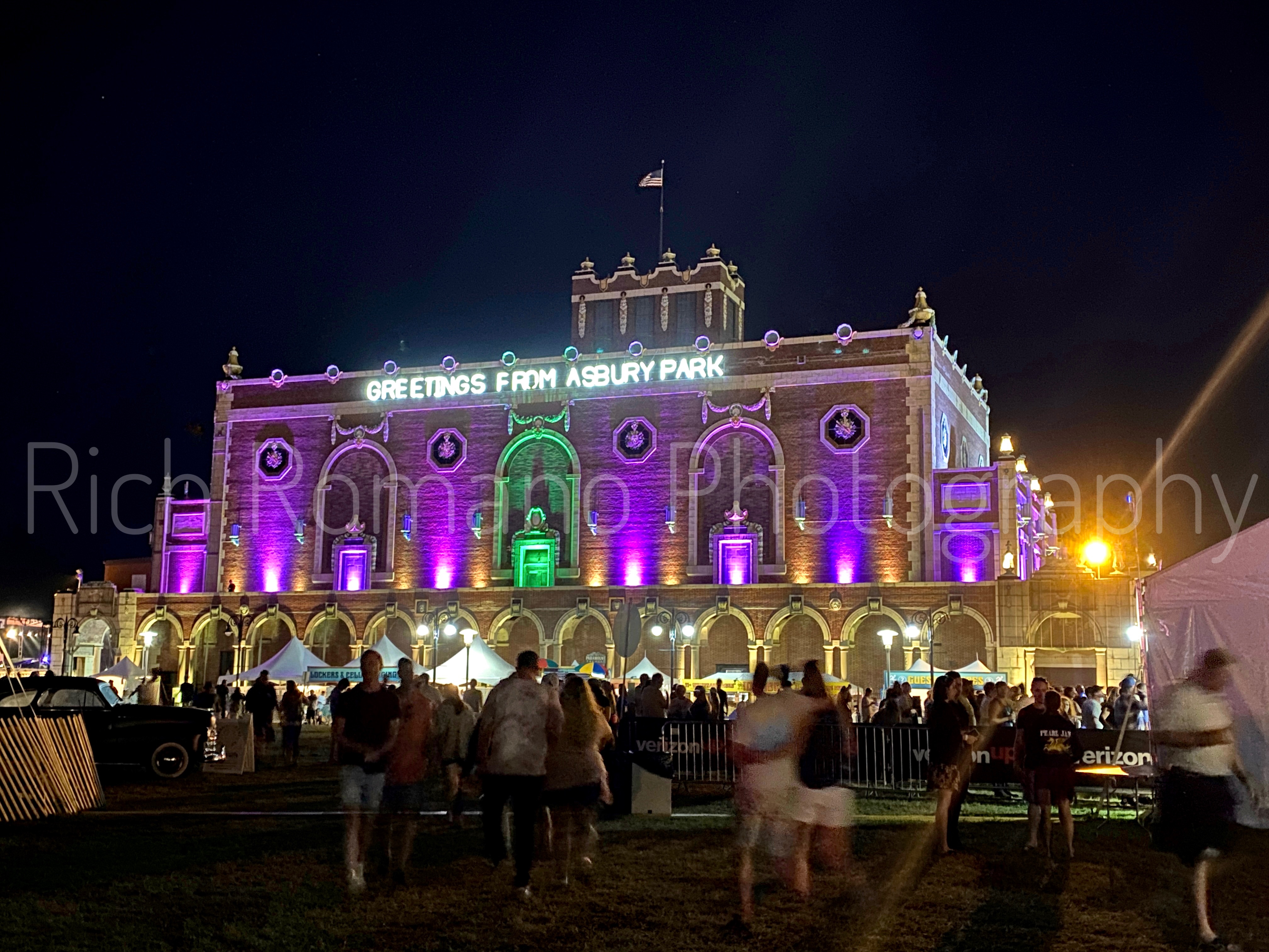 convention hall in asbury park New Jersey lit up and glowing purple at night