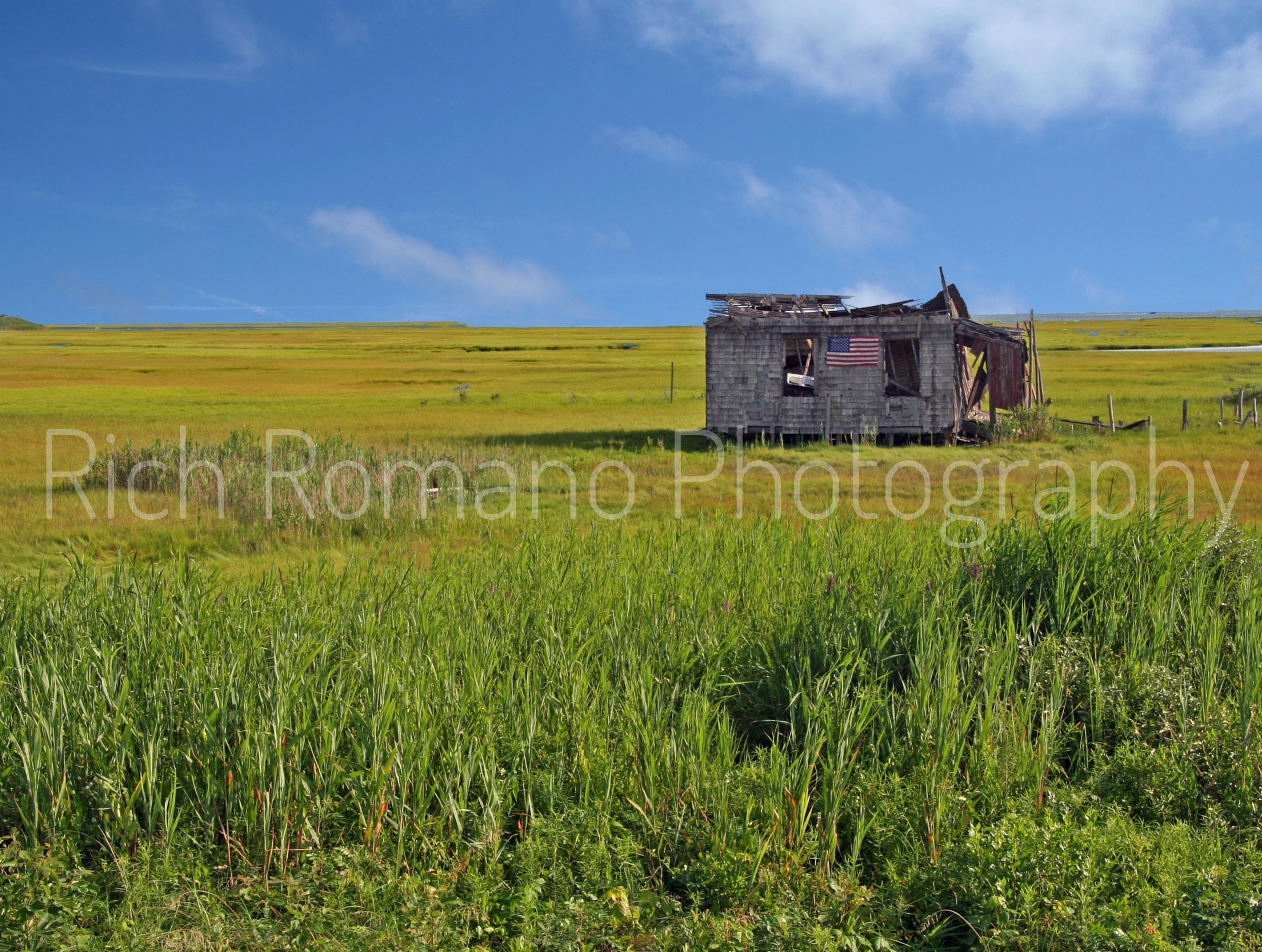 old fisherman shack in green grass along route 72 bridge heading to lbi Long Beach island jersey shore new jersey